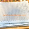 Section of corgi puppy filet crochet blanket showing pattern graph design detail