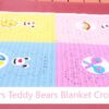 Filet crochet blanket featuring a cute bear with a smile sunshine tummy badge — beginner-friendly double crochet pattern sized from baby to adult