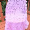 Close-up of filet crochet unicorn head motif – beginner baby blanket pattern with double crochet stitches