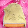 Finished crochet duckling baby blanket featuring ducklings swimming in a pond, handmade gift idea for baby showers.