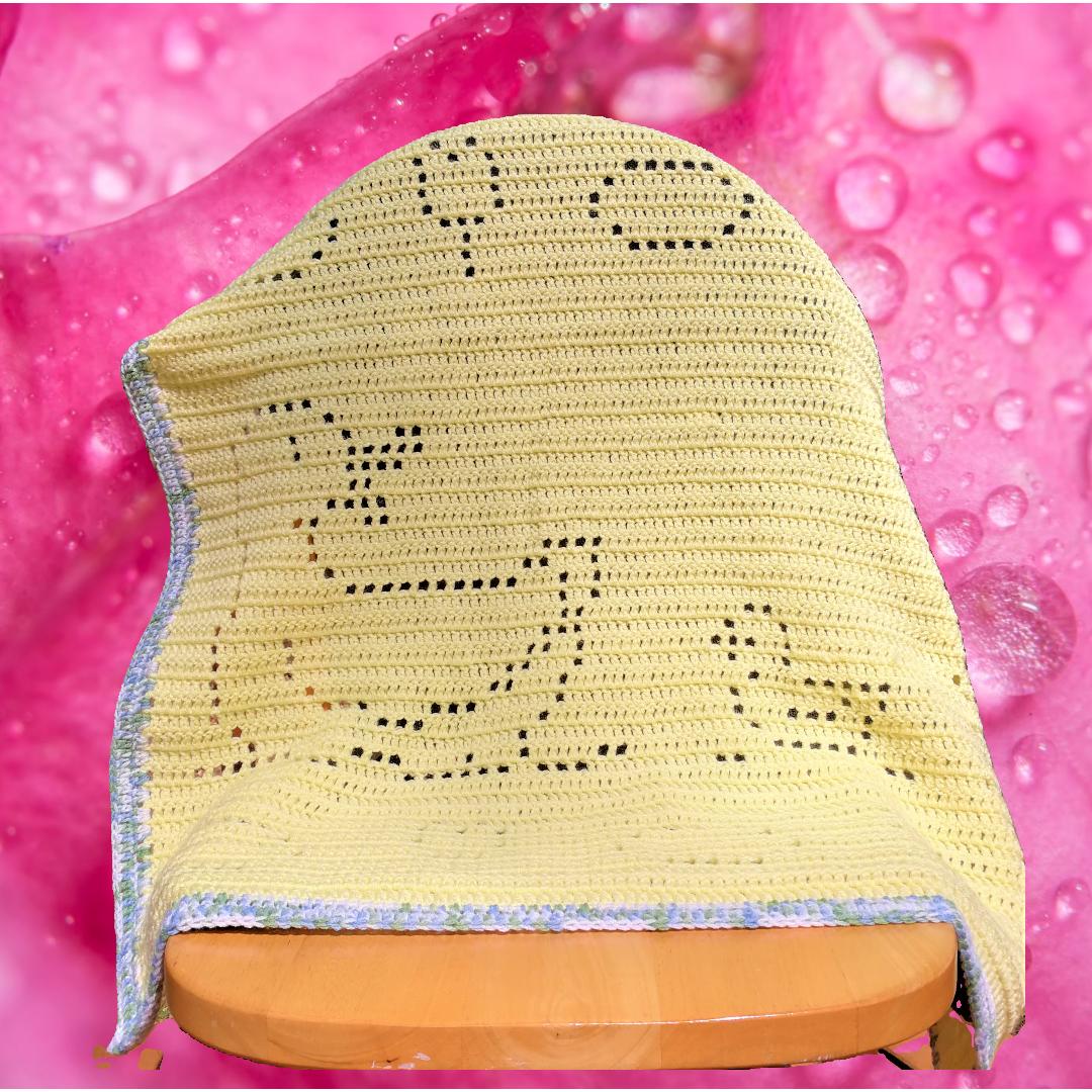 Finished crochet duckling baby blanket featuring ducklings swimming in a pond, handmade gift idea for baby showers.