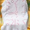 A cozy handmade koala bear filet crochet blanket featuring forest motifs, suitable for babies or toddlers, crafted with soft baby blanket yarn.