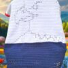 Red, white, and blue filet crochet eagle blanket with star motifs, a beginner-friendly handmade patriotic throw pattern for all ages.
