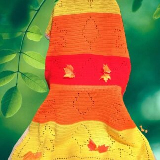 Close up of colorful autumn leaves crochet blanket pattern, suitable for babies to adults, cozy fall home decor.