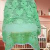 A cozy, one-color filet crochet baby blanket featuring a repeating design of cute sea turtles and hearts.
