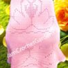 Finished Valentine’s Geese Heart crochet blanket in a classic filet stitch style draped over a chair.